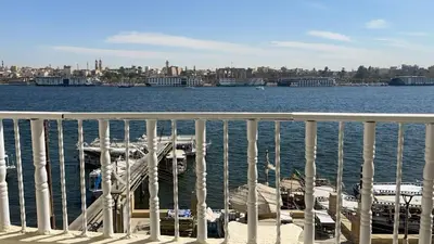 a view of the water from a pier with boats at Toutankhamon in Luxor
