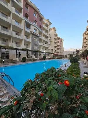 a view of the apartment buildings and the swimming pool at Florenza khamsin Resort in Hurghada