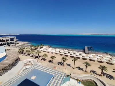 an aerial view of a beach with umbrellas and the ocean at Studil for rent in the view 608 in Hurghada