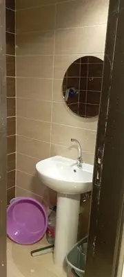 a bathroom with a sink and a mirror at Florenza Resort in Hurghada