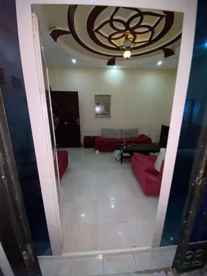 a living room with a red couch and a ceiling at Villa with private pool A F in Hurghada