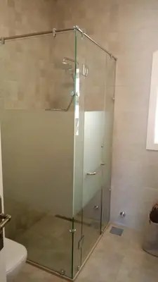 a glass shower in a bathroom with a toilet at Cozy 1BR in the Heart of Gouna in Hurghada