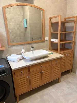 a bathroom with a sink and a mirror at Cozy 1BR in the Heart of Gouna in Hurghada