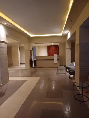 a large lobby with a stage in a building at Alhambra Avenue in Hurghada