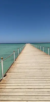 a wooden pier stretches out into the ocean at Florenze Khamsin Hurghada in Hurghada