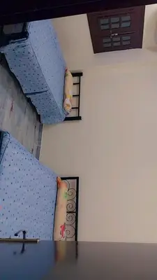 two stairs in a room with a table at Luxor downtown in Jazīrat al ‘Awwāmīyah
