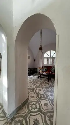 an archway in a room with a carpet at Beit El-Abd Valley of Queens View in Luxor