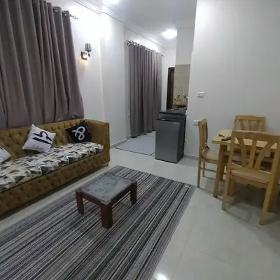 a living room with a couch and a table at Sea View Qussier in Quseir