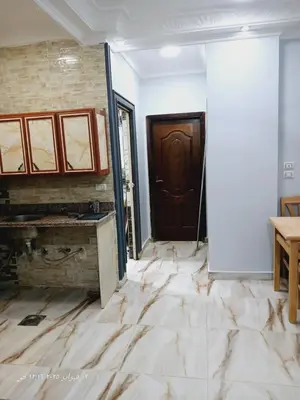 a room with marble flooring in front of a door at Hotel apartments in Hurghada