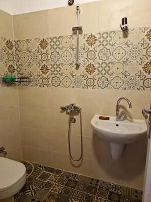 a bathroom with a sink and a toilet at House Mountain in Luxor