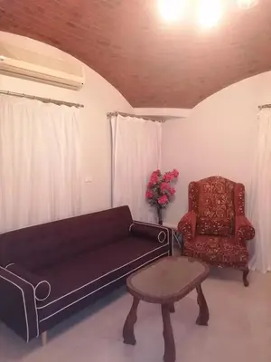 a living room with a couch and a chair at الكوثر القديم الغردقة in Hurghada