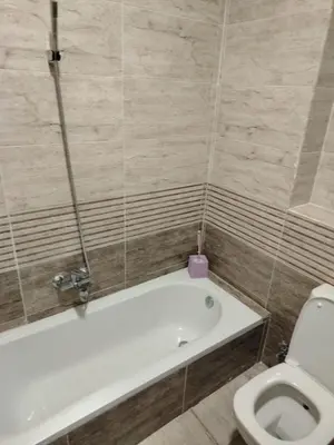 a bathroom with a bath tub and a toilet at Hurghada Fiesta Resort Studio 328 in Hurghada