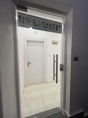 a white door with a sign on top of it at Nile Spirit Sunrise in Luxor