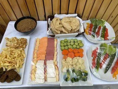 a table with different types of food on it at Nile Spirit Sunrise in Luxor