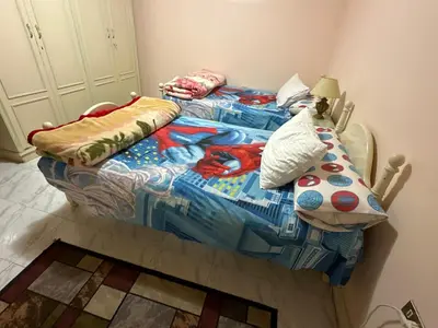 a bedroom with two twin beds in a room at Paradise Villa Seaview in Hurghada