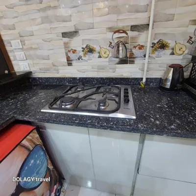 a kitchen counter with a stove top in a kitchen at Modern studio in Hurghada