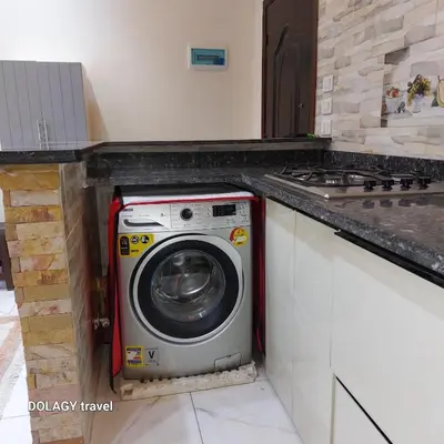a washing machine in a kitchen with a counter at Modern studio in Hurghada