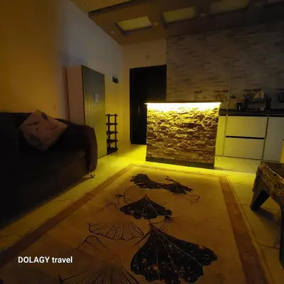a living room with a couch and a fireplace at Modern studio in Hurghada