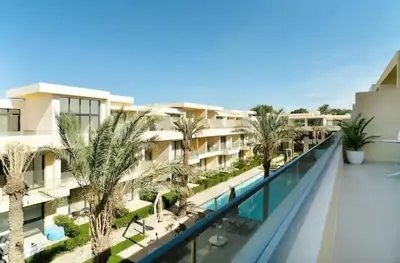 arial view of a hotel with palm trees and a swimming pool at Cozy getaway in El Gouna with pool & mountain view in Hurghada