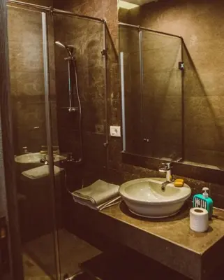 a bathroom with a sink and a glass shower at El Gouna 3 Bedroom in Sholan in Hurghada