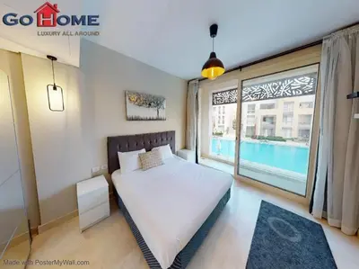 a bedroom with a bed and a large window at Mangroovy El-Gouna 1 Bedroom M7 -6B-13 in Hurghada