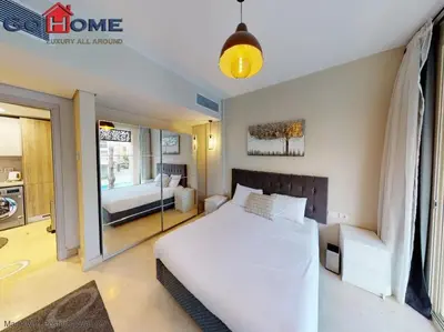 a bedroom with a large white bed and a window at Mangroovy El-Gouna 1 Bedroom M7 -6B-13 in Hurghada