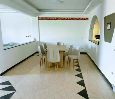 a dining room with a table and chairs at Al-Kiam Villa Private pool A F in Hurghada