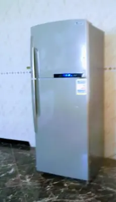 a white refrigerator sitting in a kitchen next to a wall at Al-Kiam Villa Private pool A F in Hurghada
