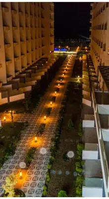an aerial view of a street at night with buildings at Scandic Resort in Hurghada