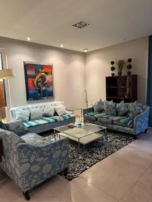 a living room with two couches and a table at Abu Tig Marnia El Gouna MB04 in Hurghada