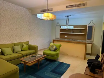 a living room with a couch and a table at Abu Tig Marnia El Gouna MB04 in Hurghada