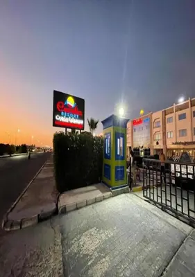 a gas station on the side of a street at night at Steps from Beach & Near Airport Furnteched, Kitchenette, full APT Free WIFI in Hurghada