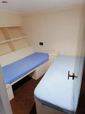 a small room with two beds in it at Zafeer in Hurghada