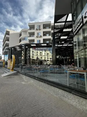a building with tables and chairs in front of it at Wonderful sea view studio in Hurghada