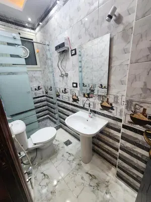 a bathroom with a toilet and a sink at Hana Stay Hostel in Luxor