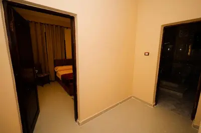 a room with a door leading to a bedroom at Nile View House in Aswan