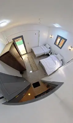 an overhead view of a room with two beds at Dreams By Mon in Al Karnak