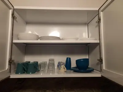 a cupboard with plates and dishes on it at Mountain house in ‘Ezbet Abu Ḥabashi