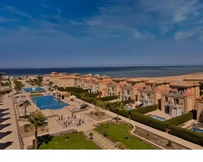 a view of a city with a resort and the ocean at Selena bay resort in Hurghada