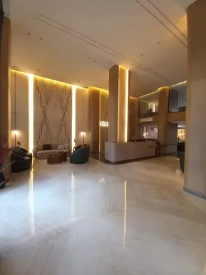 a large lobby with couches and tables in a building at Luxury studio with beach in Hurghada