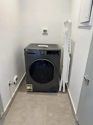 a washer and dryer sitting in a laundry room at Fanadir Marina Vista in Hurghada
