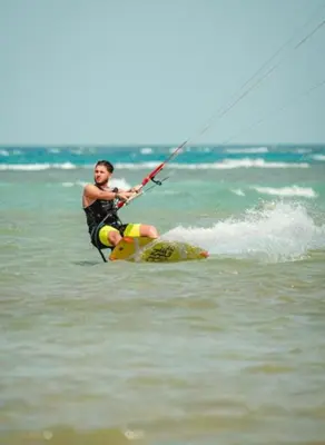 a man on a board in the water at Selena bay resort in Hurghada