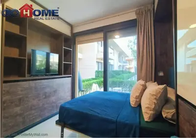 a bedroom with a bed and a tv and a window at Cozy Studio 1BR G Cribs b19-g7 El-Gouna Shared Heatd Pool in El Gouna