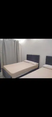 two beds sitting next to each other in a room at Hurghada European style in Hurghada
