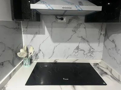 a kitchen with a black and white counter top at Scandic sea view in Hurghada