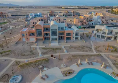an aerial view of a resort with a swimming pool at Sophisticated 1BR 1,5 Bath Duplex - Kamaran El Gouna, Pool View & Access in Hurghada