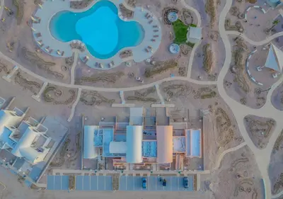 an aerial view of a resort with a pool at Sophisticated 1BR 1,5 Bath Duplex - Kamaran El Gouna, Pool View & Access in Hurghada