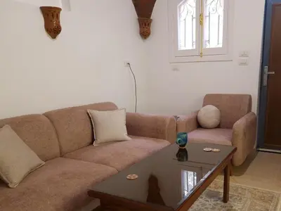a living room with a couch and a coffee table at House Mountain Luxor - Villa for rent in Luxor