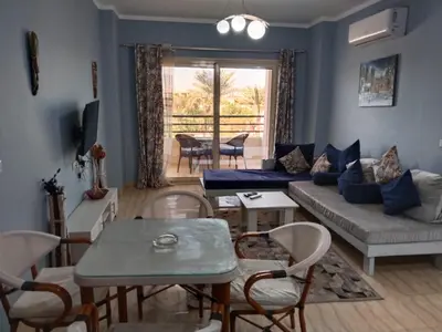 a living room with a couch and a table at Andalus in in Hurghada
