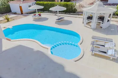 a swimming pool with a gazebo and a gazebo at Elaskary in Hurghada